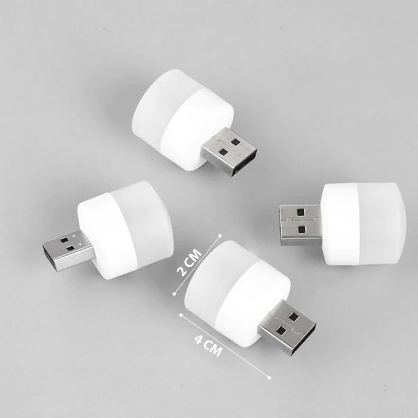 Four compact USB LED night lights with white diffusers on a grey background, size shown as 2x4 cm.