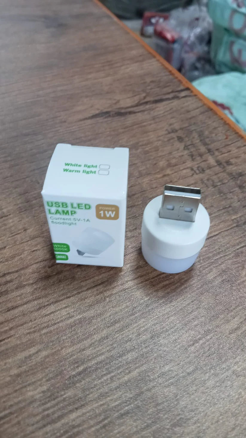 USB LED lamp 1W with packaging box on wooden table, compact portable night light